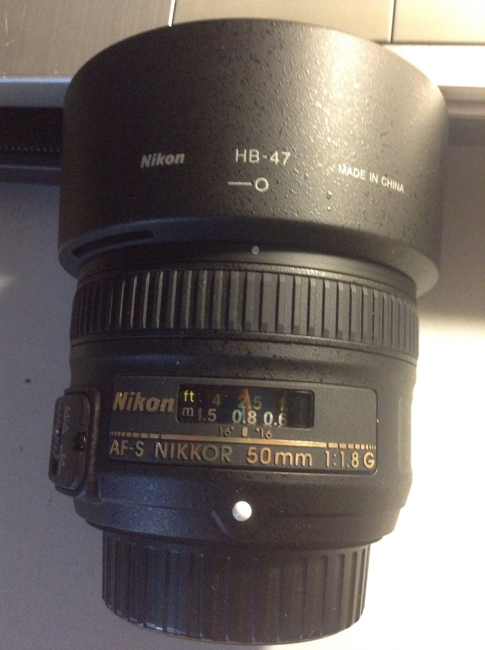 尼康35mm1.8g和佳能50mm1.8哪个虚化效果更