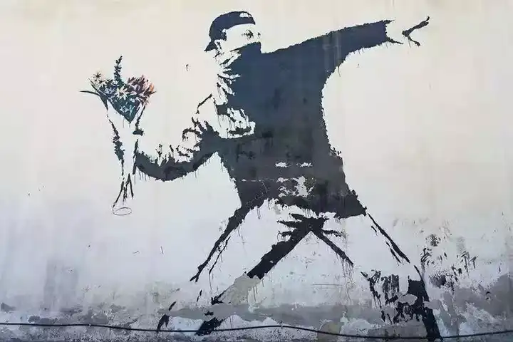 如何看待涂鸦艺术家班克西(banksy)在拍卖会上自毁作品这一行为?