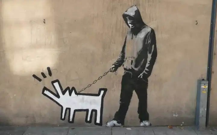 如何看待涂鸦艺术家班克西(banksy)在拍卖会上自毁作品这一行为?