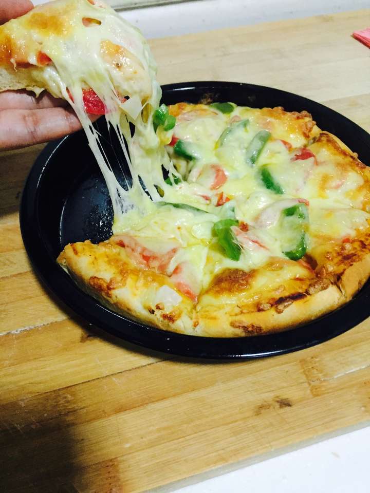 家庭自用烤箱烤出来的披萨中间发黏上面已经糊了怎么回事.