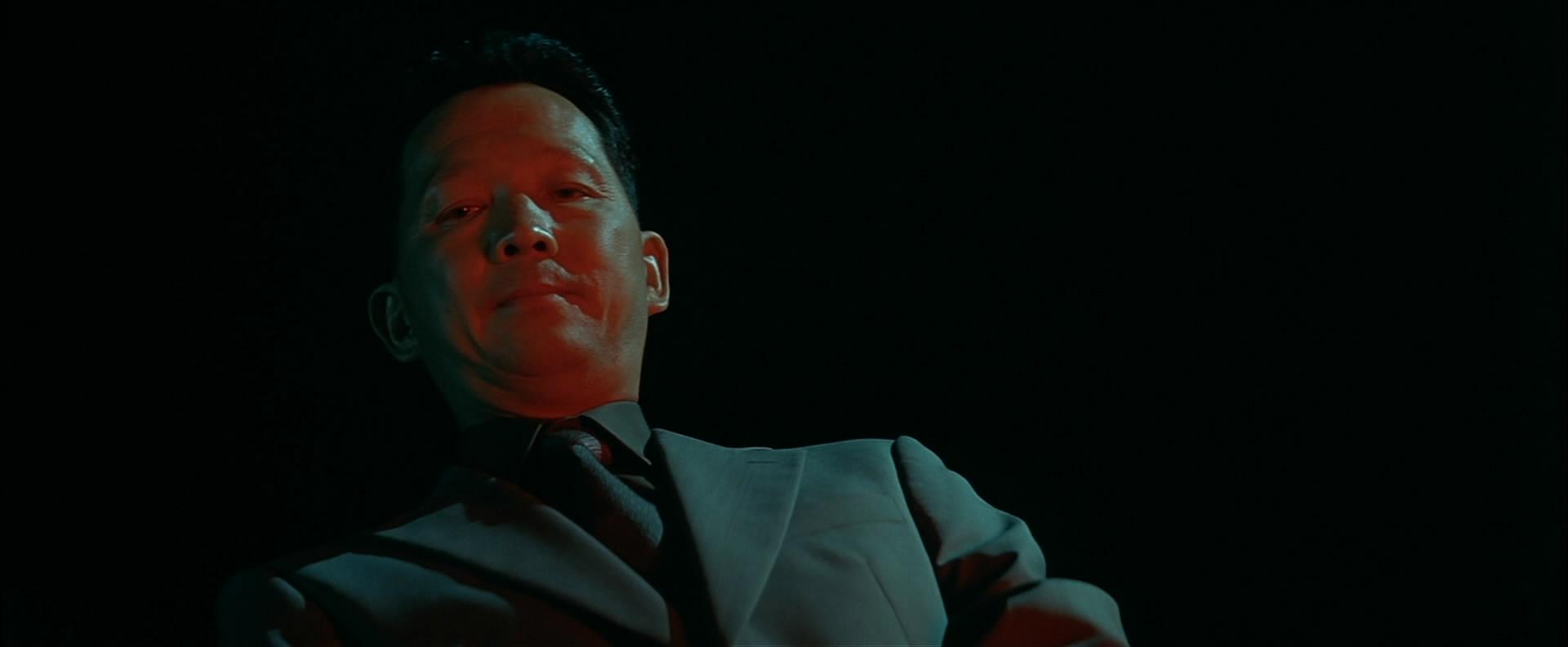 电影《无间道》里三叔把黑鬼埋了之后为什么要吹口琴?