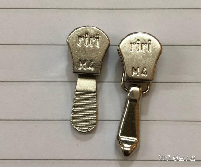假真3)m6规格的riri拉链头真品如下图所示:字母riri的位置较m4规格更