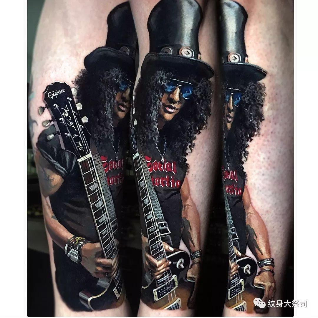 slash在欧美人气极高,有很多关于他的纹身,帅炸!