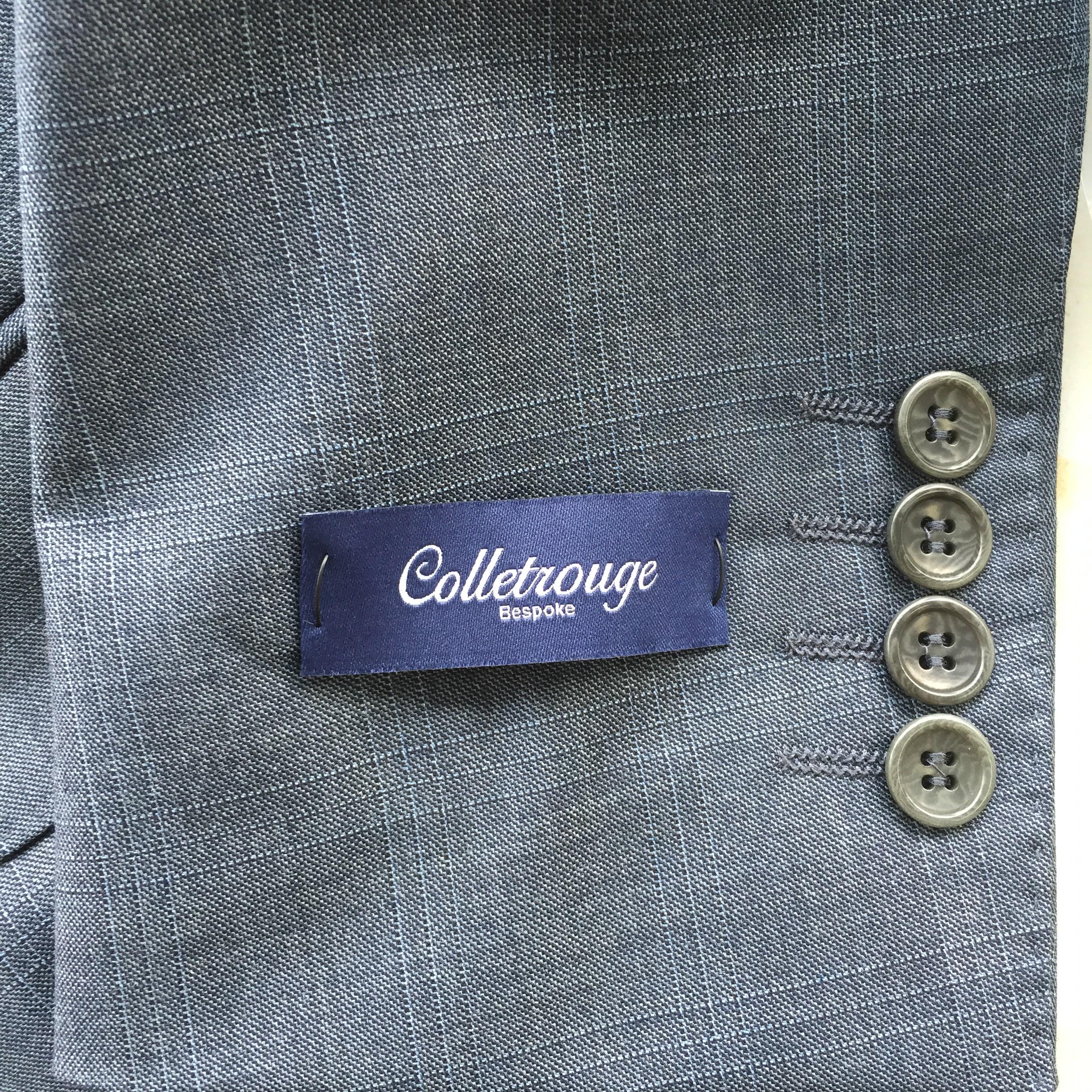 为什么西装袖子上有个商标